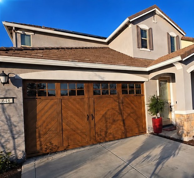 After: new custom wood-look garage door installed