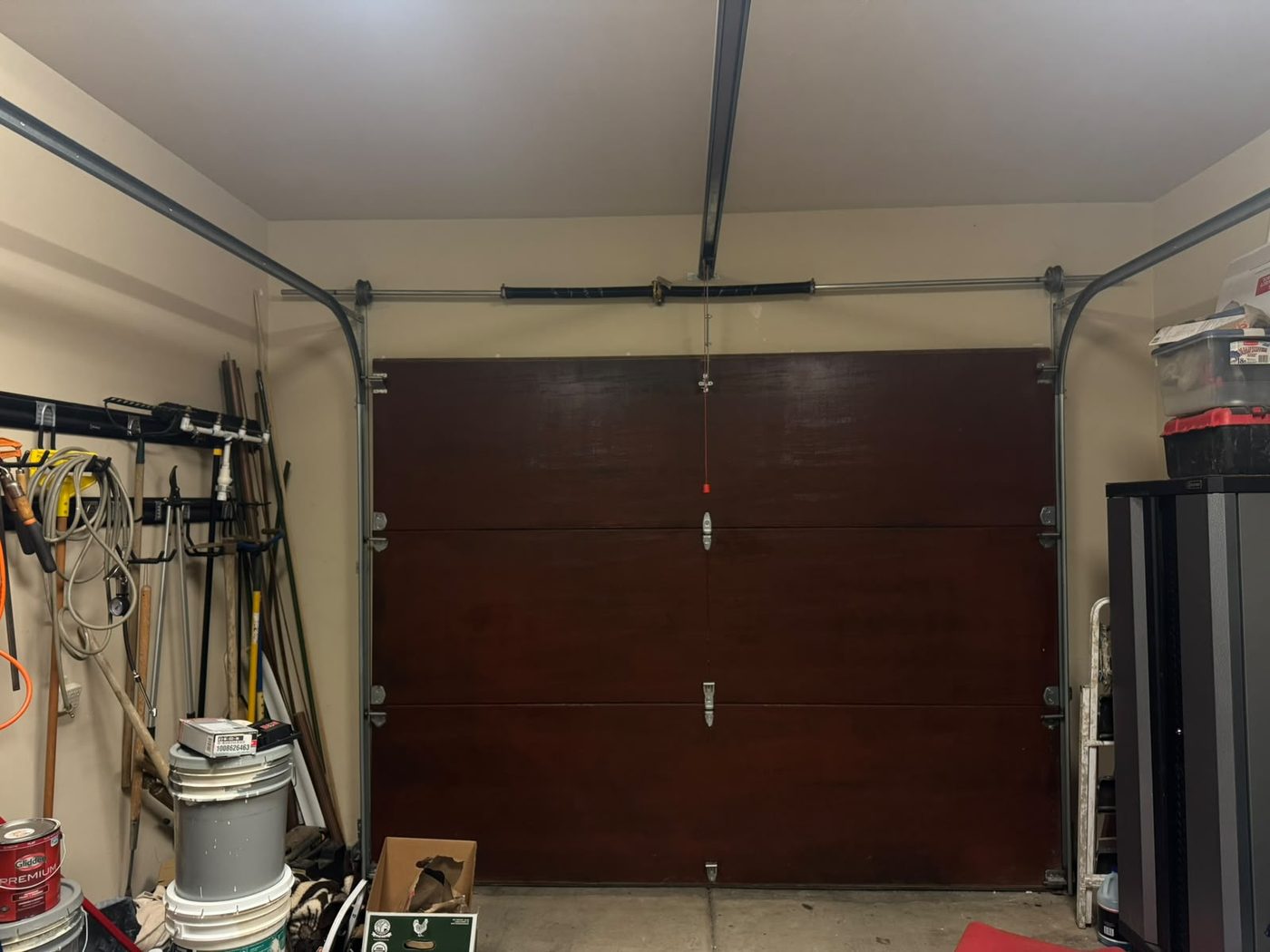 New torsion springs and tracks installed above a garage door
